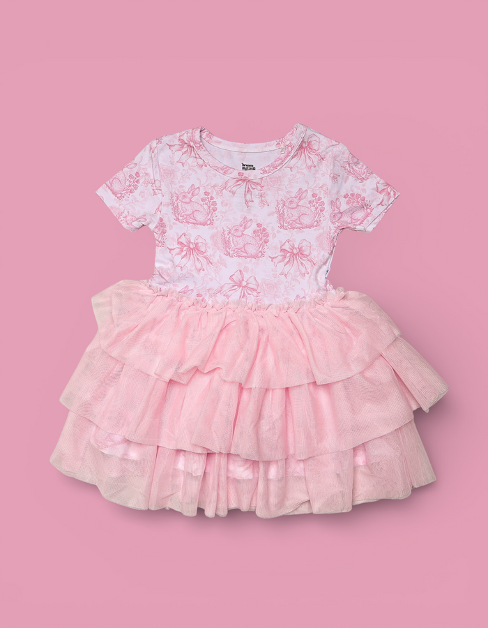 Pink and white toile print short-sleeve dress with tiered tulle skirt.