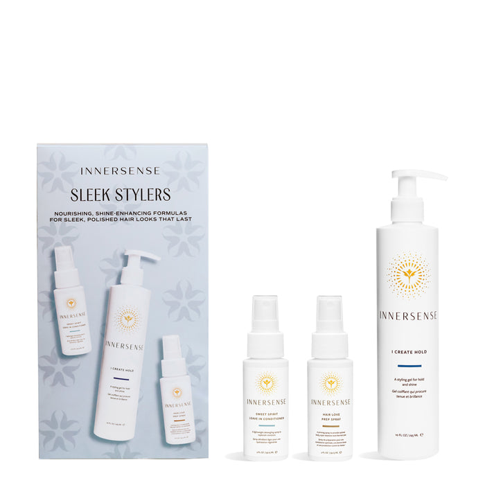 The image displays the Innersense Holiday Kit - Sleek Stylers 3pc, which includes a set of hair care products. The products are arranged in front of a packaging that features a white background with decorative elements.