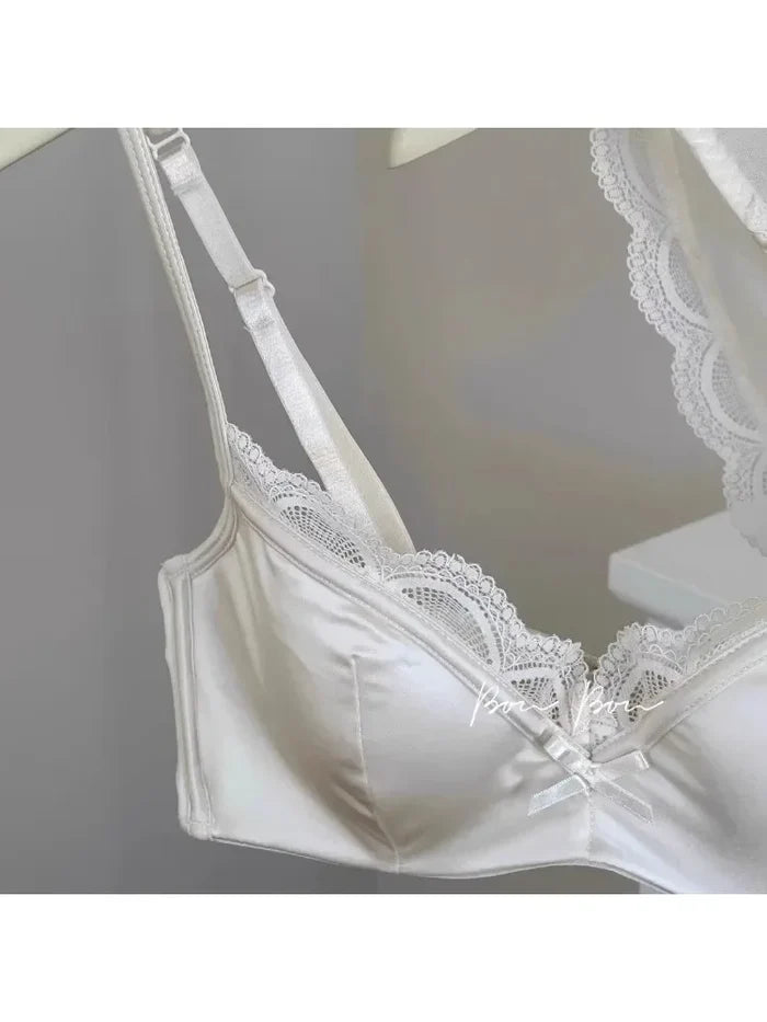 White lace bra on a gray background