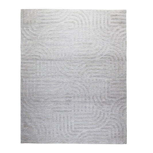 The Tufted Teal Jules Rug 300x240cm features a subtle geometric pattern of curved and straight lines, bringing understated Mid-Century style to any space.